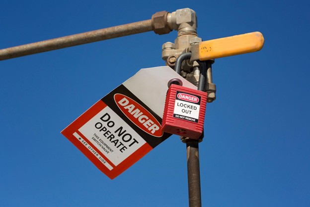 Danger Do Not Operate lockout tag on a valve for safety identification
